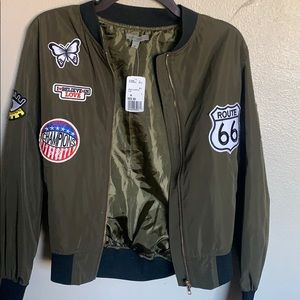 Green bomber jacket with patches